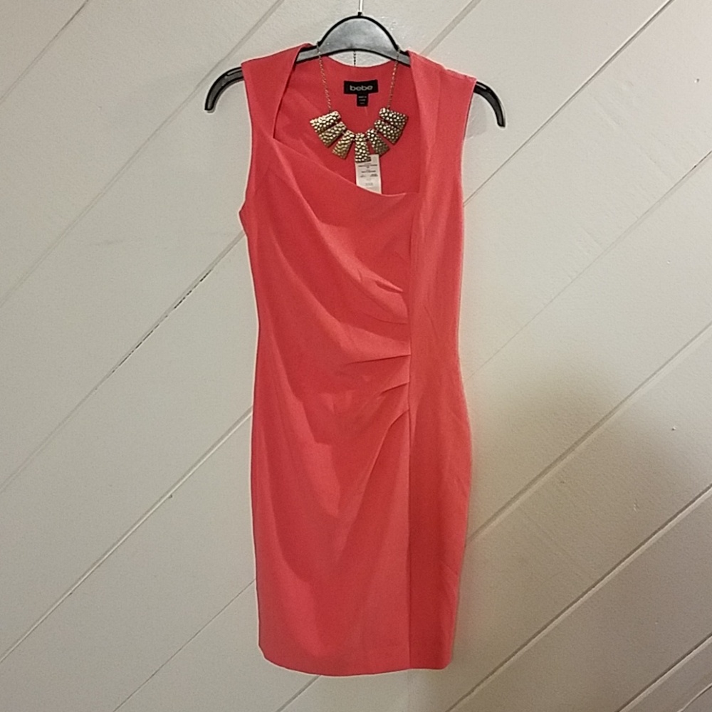 NWT Bebe dress with Asymmetrical neck Coral sz XXS